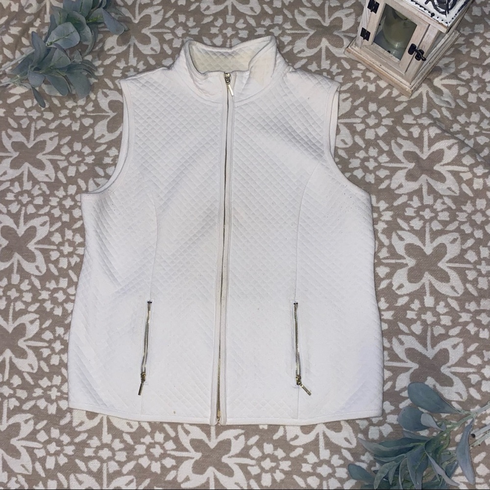 White sweater vest.
